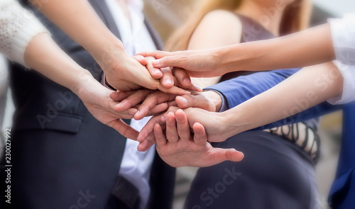 Business teamwork concept. Business persons is joining their hands to show spirit in workplace. Power to success together.