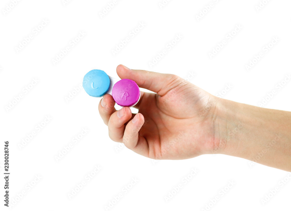 Hand holding the lens to the eye. Close up. Isolated on white background Hand holding the lens to the eye. Close up. Isolated on white background