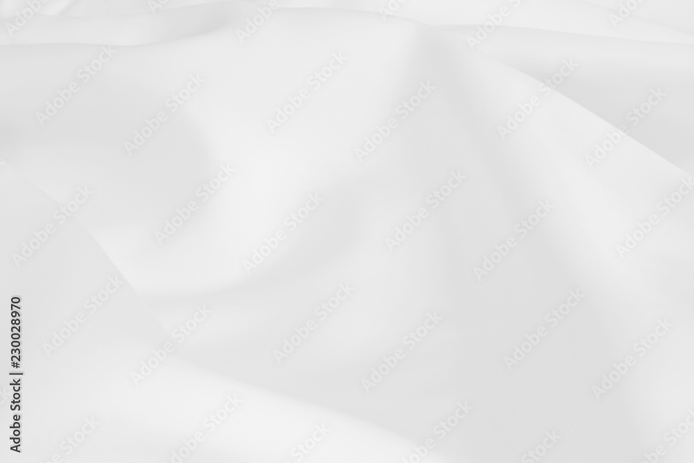 Abstract crumpled white light wedding background with silk, satin or cloth folds and drapes fabric texture. Luxury cloth,wavy grunge satin textured velvet material or luxurious Christmas holiday.