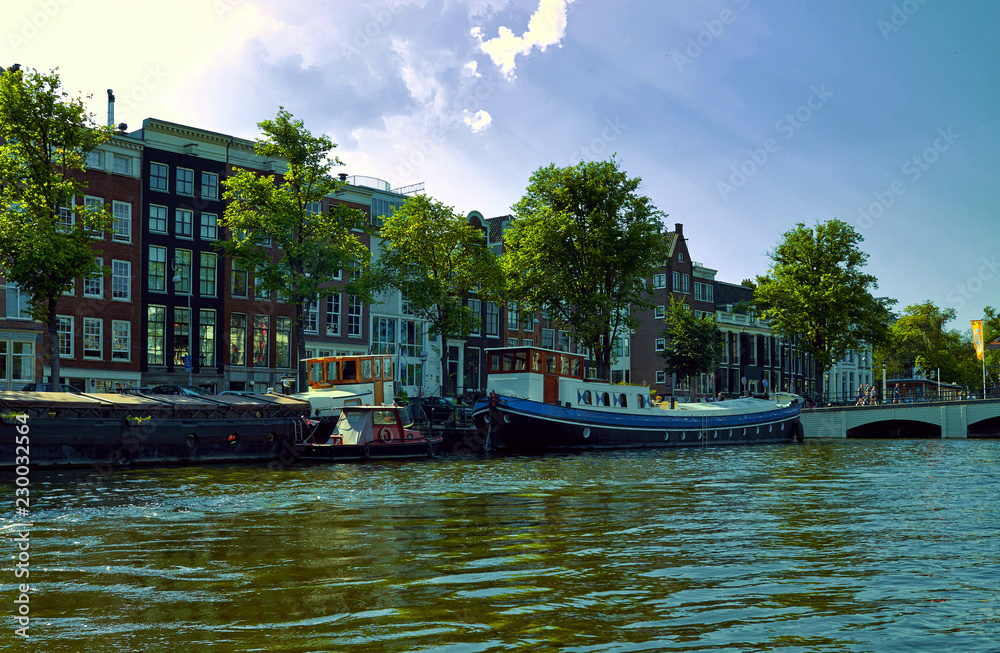 Canals and boats of Amsterdam. Holland July 2018