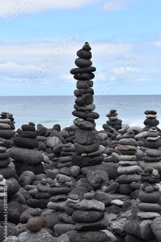 Stacked stone figures on the beach playa jardin in Tenerife in Puerto de la Cruz in Europe