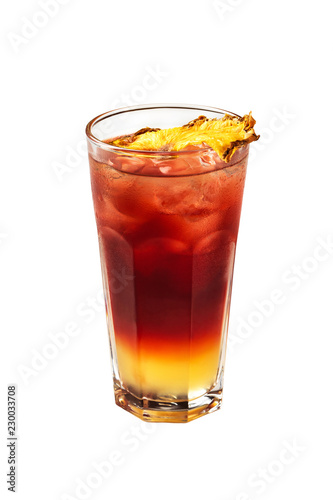 Closeup glass of tequila sunrise cocktail decorated with pineapple isolated at white background.