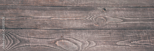 Background of wooden texture boards with remnants of pink paint.