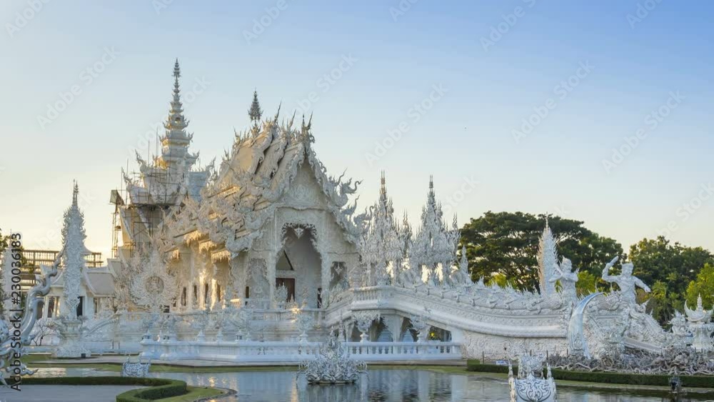 Wat Rong Khun beautiful white temple famous landmark travel place and popular of Chiang Rai, Thailand in evening time 4K time lapse UHD. Wat Rong Khun beautiful white temple famous landmark travel place and popular of Chiang Rai, Thailand in evening time 4K time lapse UHD.