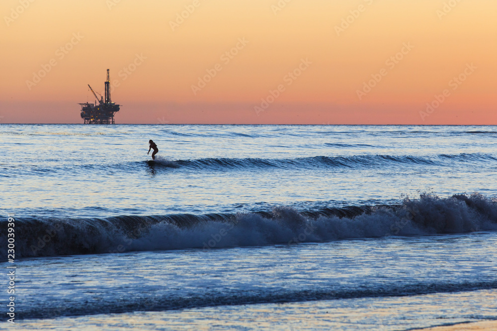 Fototapeta premium Surfer and Oil Rig