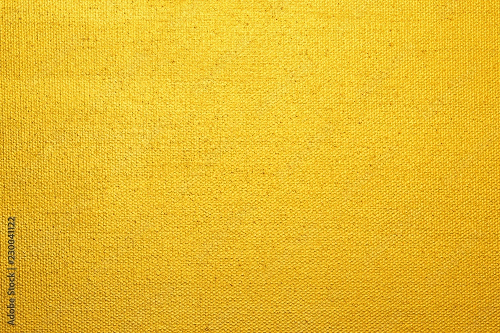 Goldgelb angemalte Leinwand als Hintergrund  - obrazy, fototapety, plakaty 