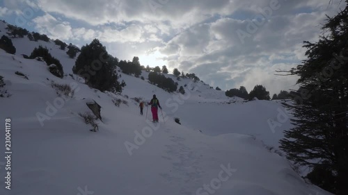 Snowshoeing in Akkar Lebanon, snow mountains of cedars and juniper, sunset 2 photo