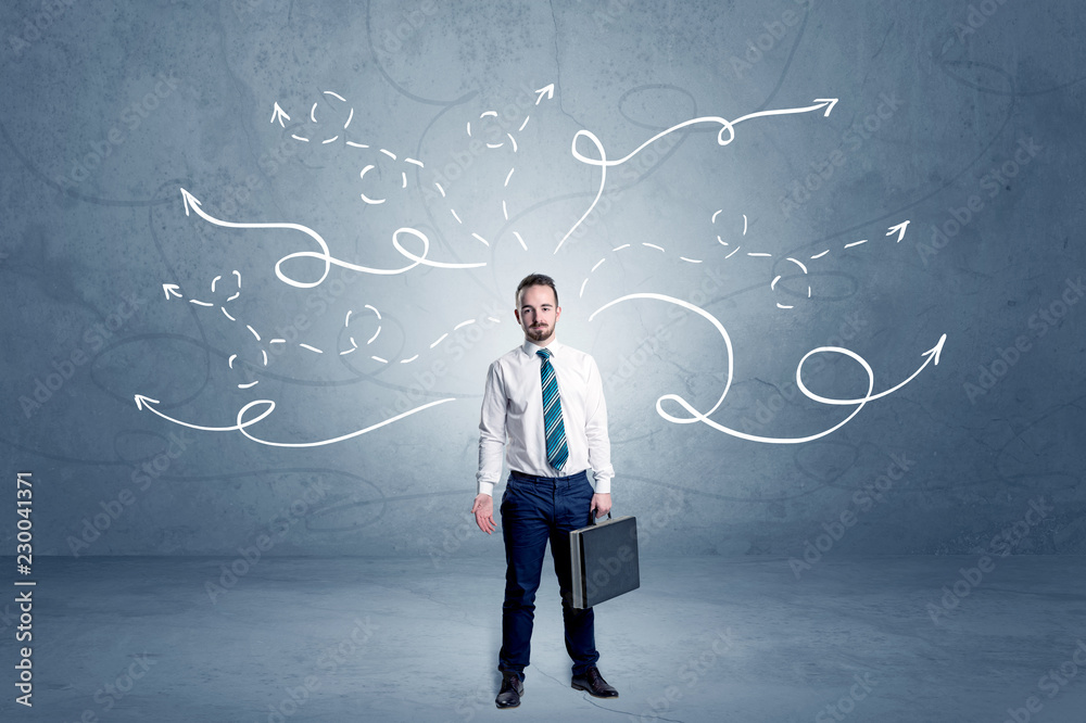 Elegant businessman choosing between directions with winding drawn arrows around
Elegant businessman choosing between directions with winding drawn arrows around