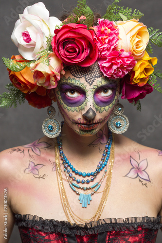 Girl wearing makeup for the dia de los muertos. The day of the dead.
