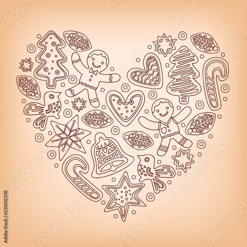 Christmas baking concept. Heart shape formed by various gingerbread figures featuring candy canes, christmas trees, holly, stars, bells, doves and hearts.