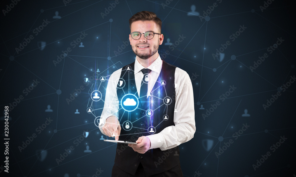 Secured cloud hologram on tablet holded by spectacled young businessman in suit
Secured cloud hologram on tablet holded by spectacled young businessman in suit