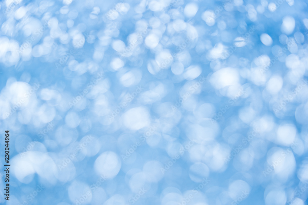 Elegant winter bokeh background. Seasonal cooling light decorative abstract design element Elegant winter bokeh background. Seasonal cooling light decorative abstract design element