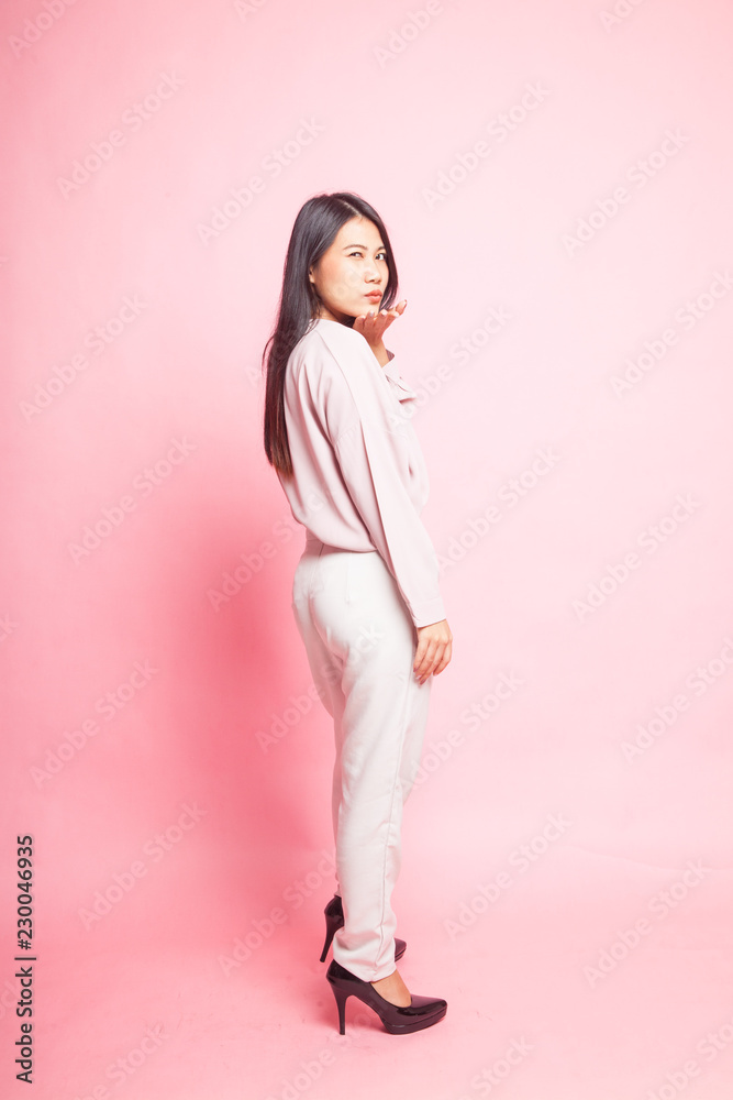 Beautiful young Asian woman in pink shirt Beautiful young Asian woman in pink shirt