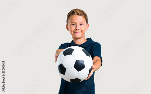 Little kid playing soccer © luismolinero