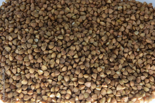 Fresh loose buckwheat groats, brown grains of buckwheat