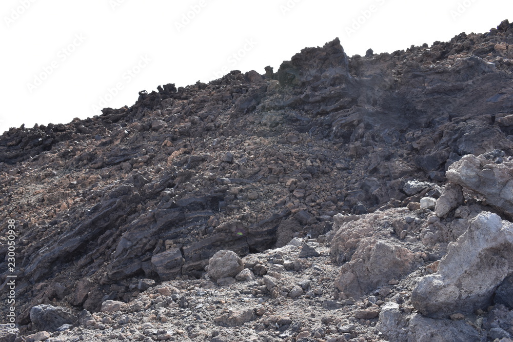 Big lava stones at the hiking trail to the big famous volcano Pico del Teide in Tenerife, Europe