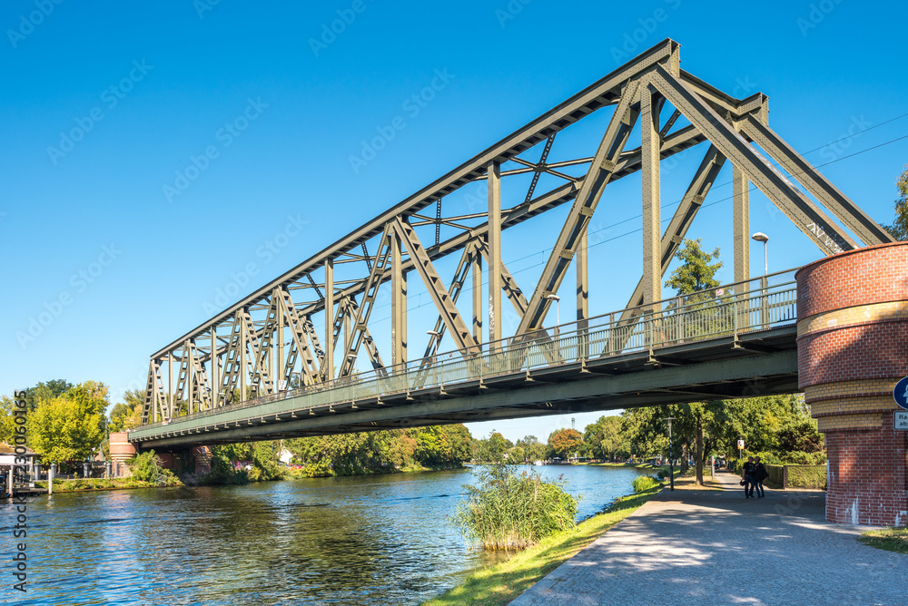 Obraz premium Railway bridge in the small town Caphut is crossing the river Havel in the state of Brandenburg, Germany