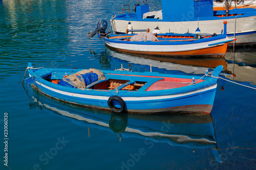 View of traditional Sicilian colorfull fishing boat in the harbour