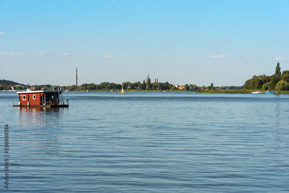 Houseboat on the river Havel southerly from Berlin. The river forms several lakes in the state of Brandenburg, Germany