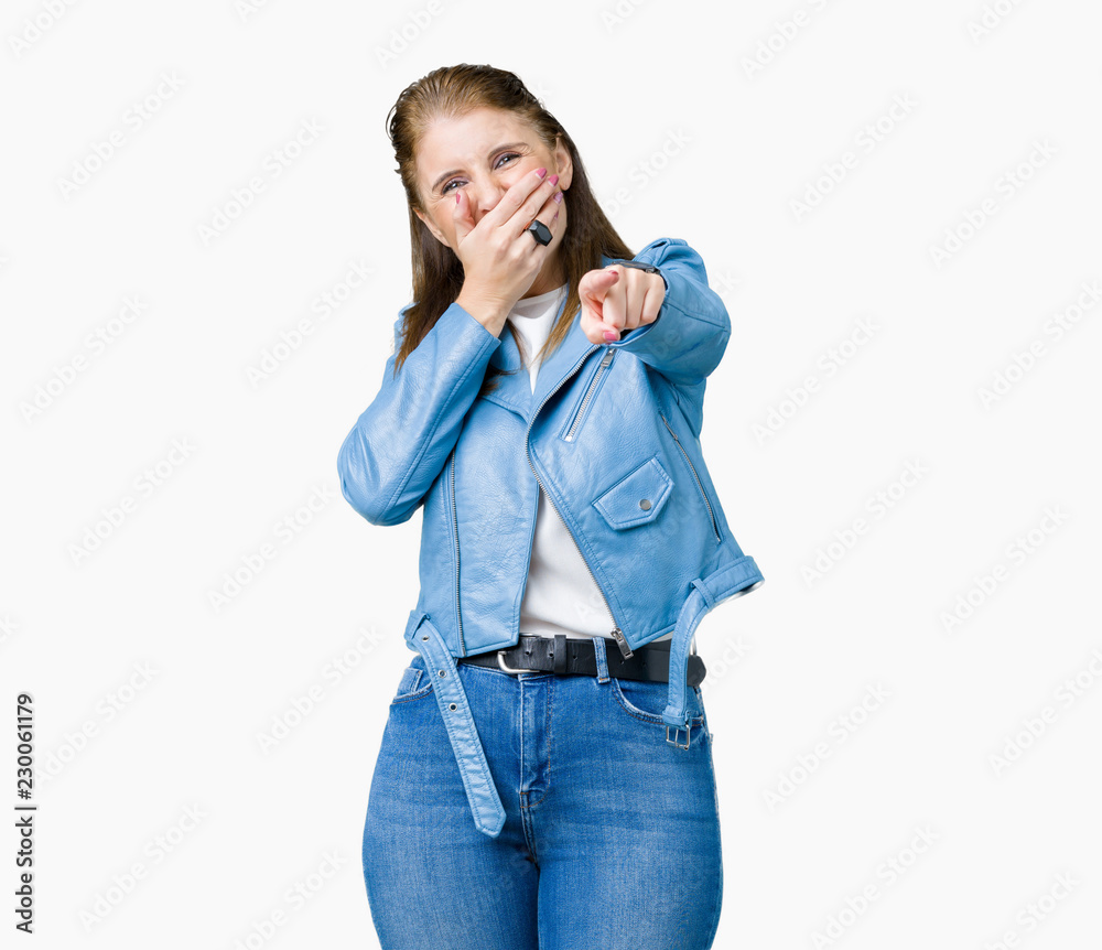 Beautiful middle age mature woman wearing fashion leather jacket over  isolated background Laughing of you, pointing to the camera with finger  hand over mouth, shame expression Stock Photo | Adobe Stock