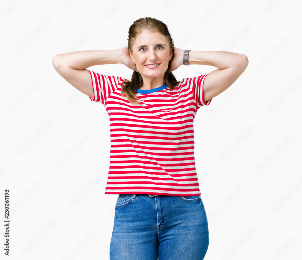 Middle age mature woman wearing casual t-shirt over isolated background Relaxing and stretching with arms and hands behind head and neck, smiling happy Middle age mature woman wearing casual t-shirt over isolated background Relaxing and stretching with arms and hands behind head and neck, smiling happy