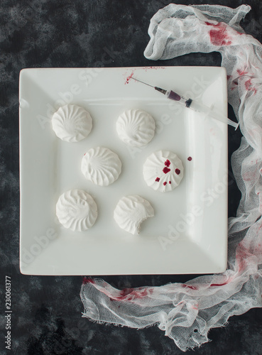 Marshmallow in drops of food coloring (like blood) in Halloween style