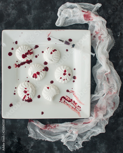 Marshmallow in drops of food coloring (like blood) in Halloween style