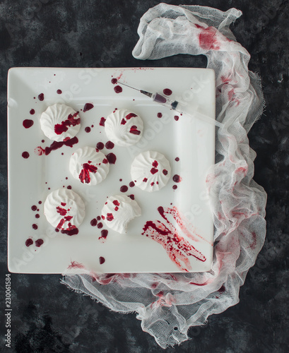 Marshmallow in drops of food coloring (like blood) in Halloween style
