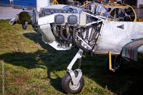 Lightweight single-engine aircraft ready for engine maintenance.