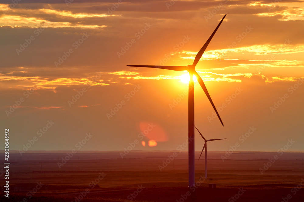 Obraz premium Wind power stations. A wind farm is a group of wind turbines in the same location used for production of electric power.