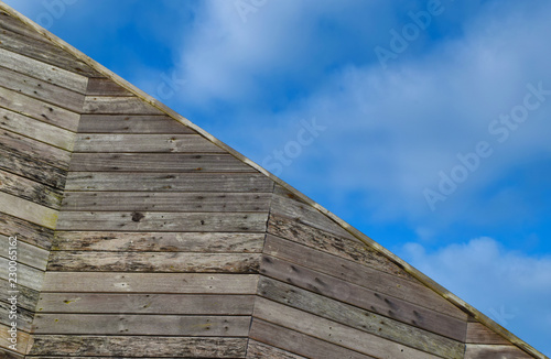 Diagonal Wooden Zig Zags with Cloudy Blue Sky