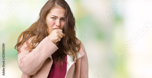 Beautiful plus size young woman wearing winter coat over isolated background feeling unwell and coughing as symptom for cold or bronchitis. Healthcare concept.