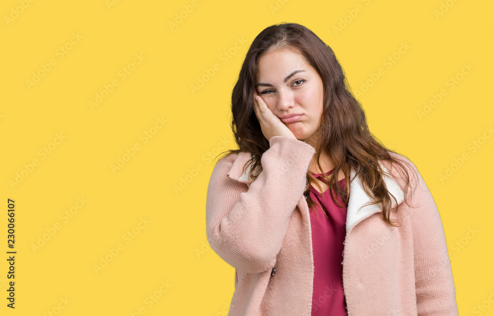 Beautiful plus size young woman wearing winter coat over isolated background thinking looking tired and bored with depression problems with crossed arms. Beautiful plus size young woman wearing winter coat over isolated background thinking looking tired and bored with depression problems with crossed arms.
