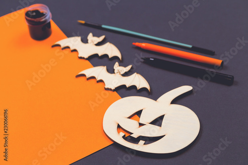 Do it yourself Halloween pumpkin and vampire bats wooden cut outs in flat lay style