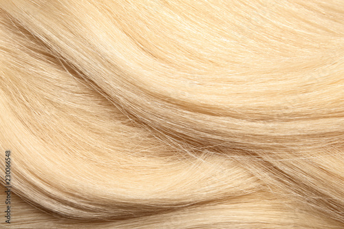 Texture of healthy blond hair as background  closeup