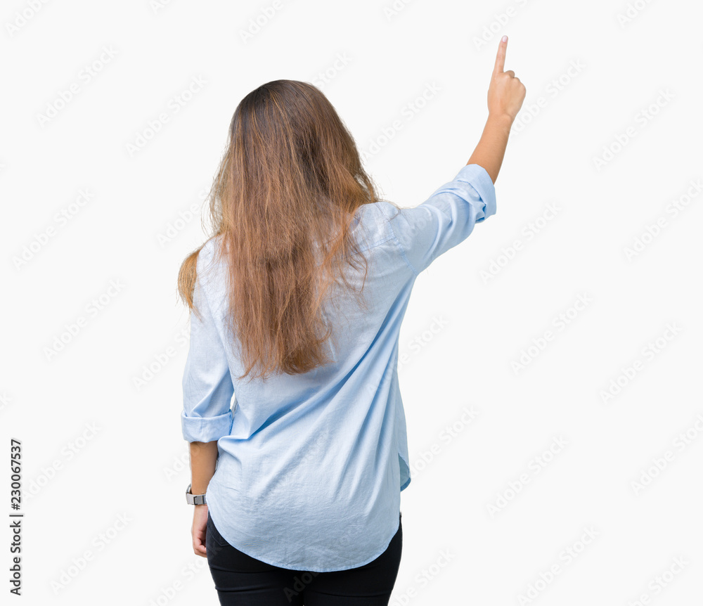 Young beautiful brunette business woman over isolated background Posing backwards pointing behind with finger hand Young beautiful brunette business woman over isolated background Posing backwards pointing behind with finger hand