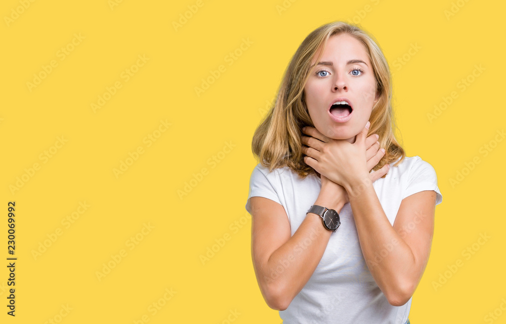 Beautiful young woman wearing casual white t-shirt over isolated background shouting and suffocate because painful strangle. Health problem. Asphyxiate and suicide concept. Beautiful young woman wearing casual white t-shirt over isolated background shouting and suffocate because painful strangle. Health problem. Asphyxiate and suicide concept.
