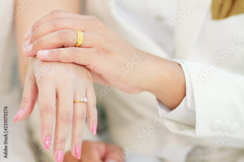 Closeup an image of engagement ring inserted into finger.