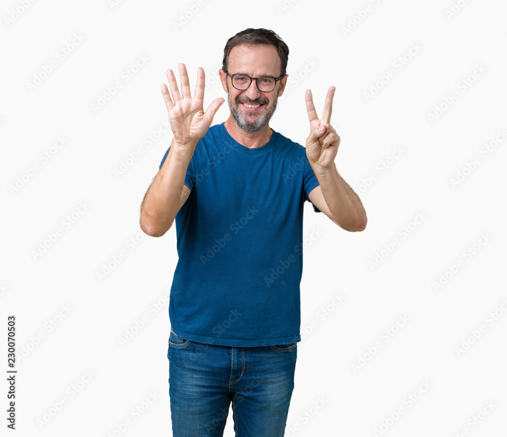 Fototapeta premium Handsome middle age hoary senior man wearin glasses over isolated background showing and pointing up with fingers number seven while smiling confident and happy.