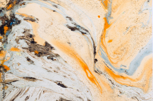 Abstract background for text or image. Ebru technique. Modern art. Marbled paper. Marbleized effect. Marble paper texture. Orange.