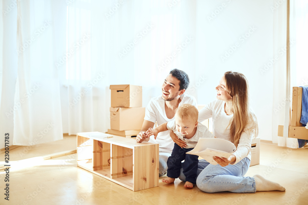 Little boy haelp for parents, assembly furniture in new home Little boy haelp for parents, assembly furniture in new home