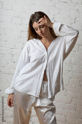 Moscow a photoshoot in studio with the charming girl. A photoshoot in a light dressing gown of white color.