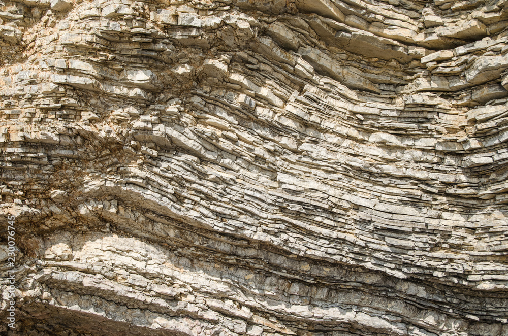 Rock, the background of the layers of ancient sediments. Rock, the background of the layers of ancient sediments.