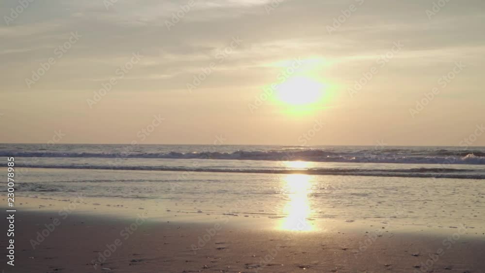Sunset on the beach with light waves Sunset on the beach with light waves