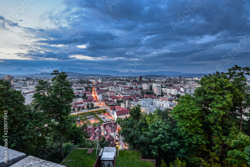 Evening view on Ljubljana old town and city center from Ljubljana Castle, Slovenia. Alps and Ljubljana cityscape.