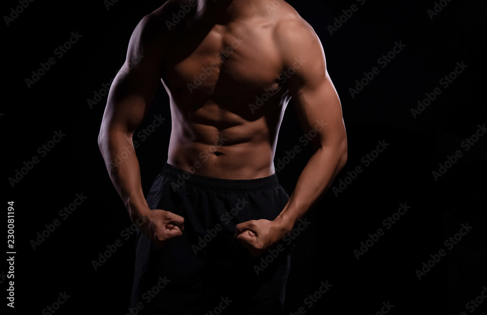 The human with muscular torso on black background,show fit and firm body,strong muscle The human with muscular torso on black background,show fit and firm body,strong muscle