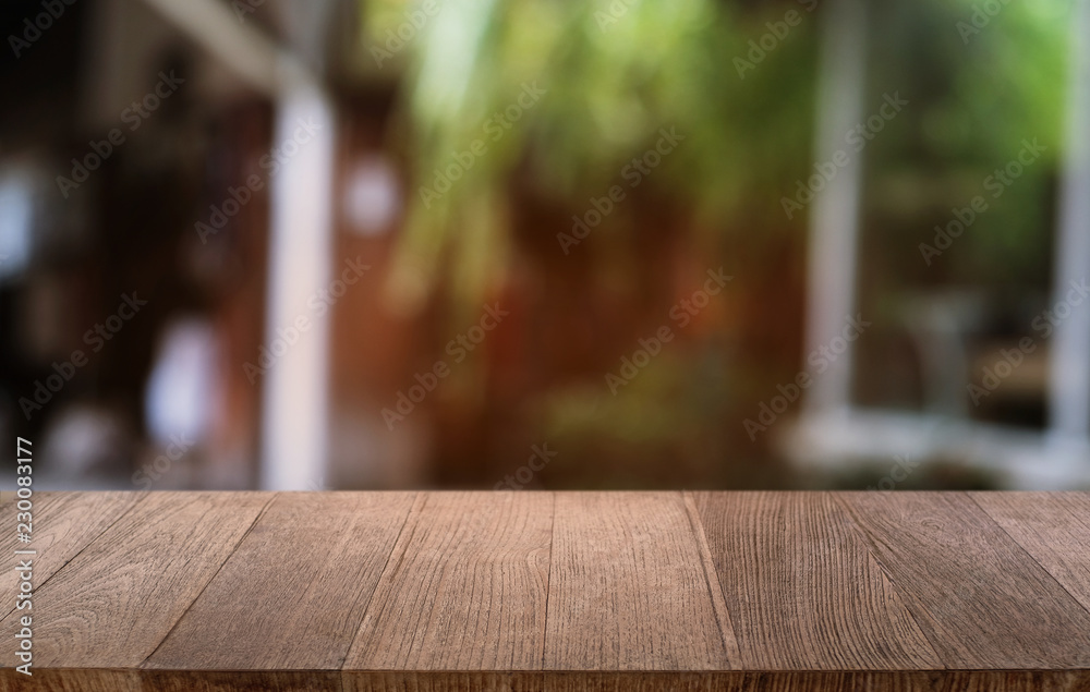 Empty dark wooden table in front of abstract blurred bokeh background of restaurant . can be used for display or montage your products.Mock up for space. Empty dark wooden table in front of abstract blurred bokeh background of restaurant . can be used for display or montage your products.Mock up for space.