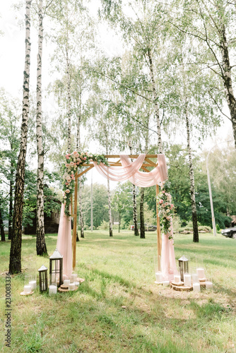 Stylish decor at a forest wedding among birches.