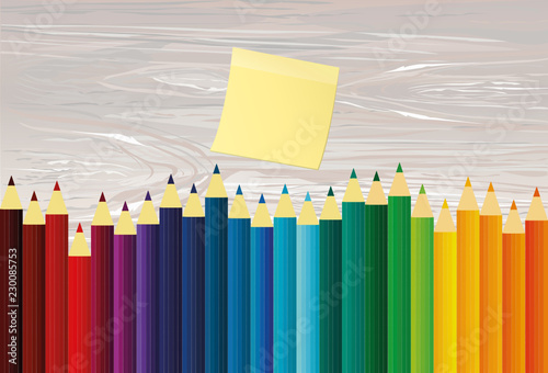 Colorful pencis. Yellow sheet of paper for notes. Sticker. Vector on wooden background. photo