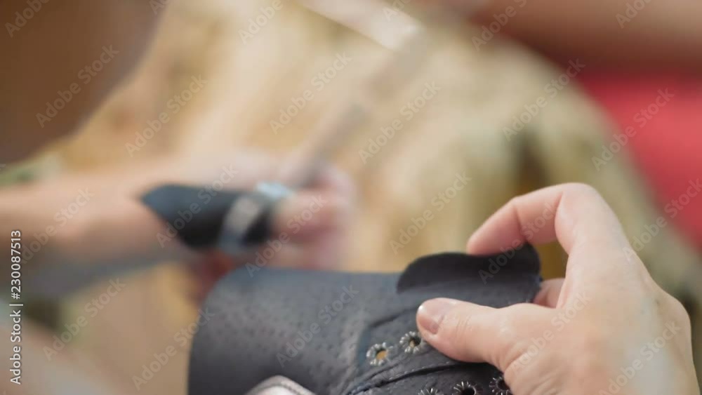 Close-Up, Woman's Hands Handle Leather Shoe Blanks, Cuts Off Excess Parts with Scissors Close-Up, Woman's Hands Handle Leather Shoe Blanks, Cuts Off Excess Parts with Scissors